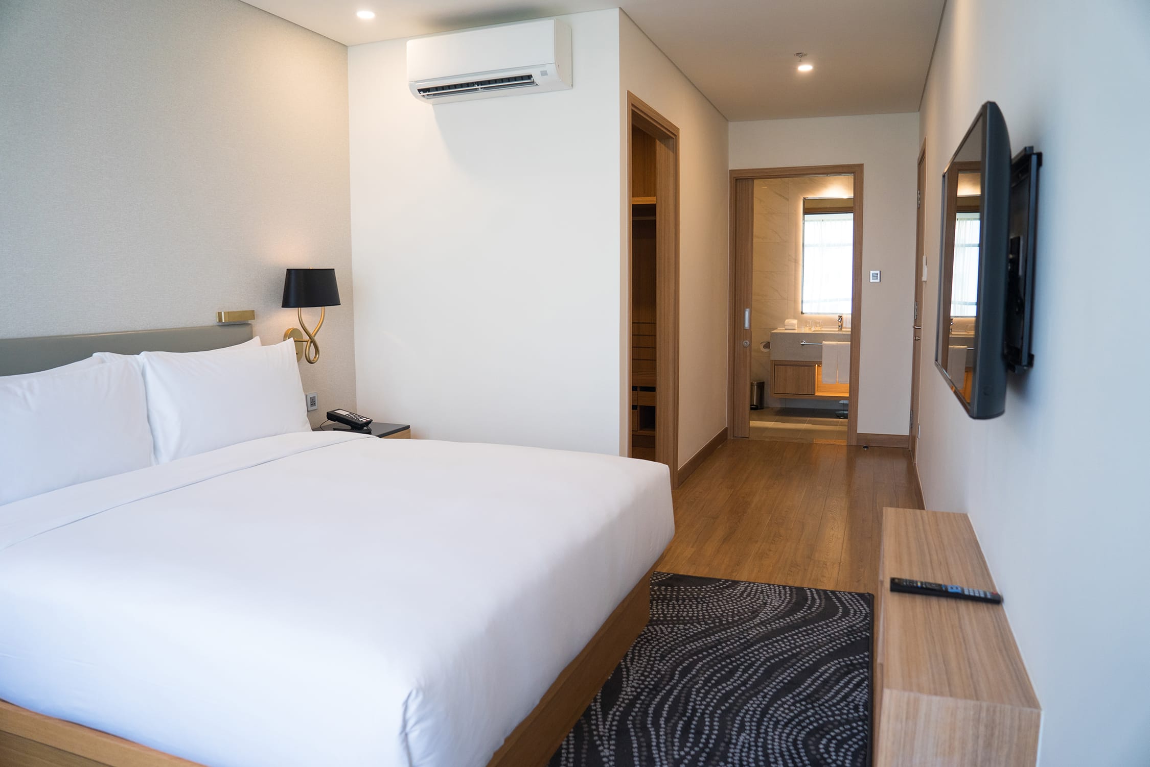 small-hotel-room-interior-with-double-bed-bathroom